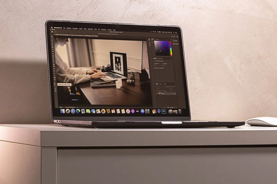 A contemporary workspace with two computer monitors showing web design projects, highlighting technology and productivity.